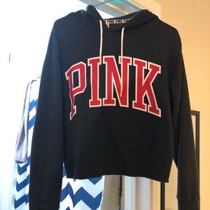 Pink cropped hoodie. Black and red.
